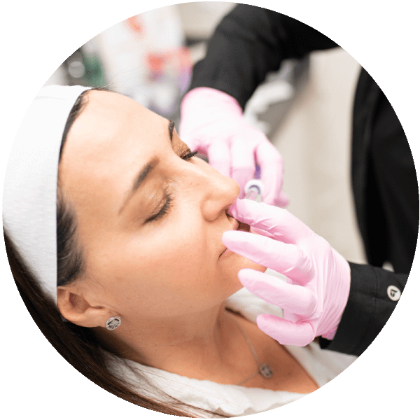 close up of woman receiving a dermal filler injection from a skin care professional