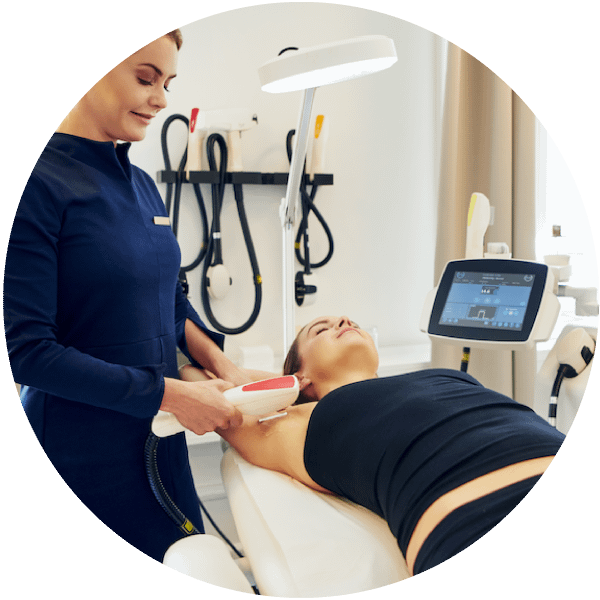 woman receiving electrolysis hair removal treatment in under arm area